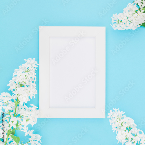 Blank frame mockup with white flowers