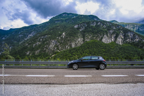 Longarone, Italy - July, 12, 2018: Alpine landscape with the image of mountain road © Dmitry Vereshchagin