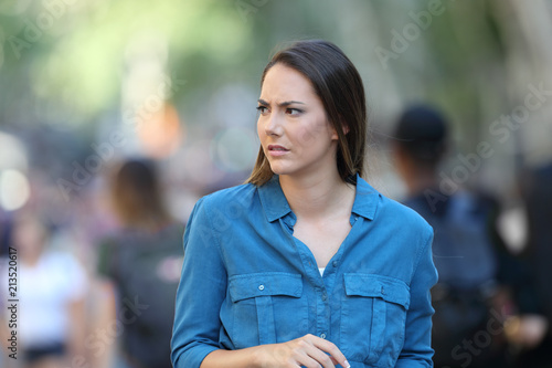 Anxious woman walking on the street