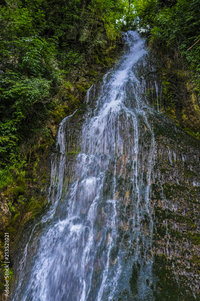 Naklejka premium Alpine landscape with the image of waterfall