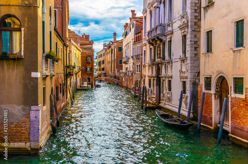 View of Venetian Canal with Gondola in Venice, Italy