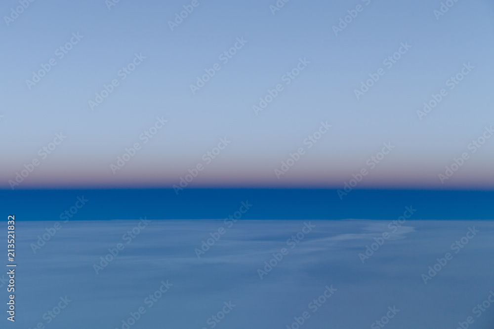 Obraz premium Dusk, over the clouds