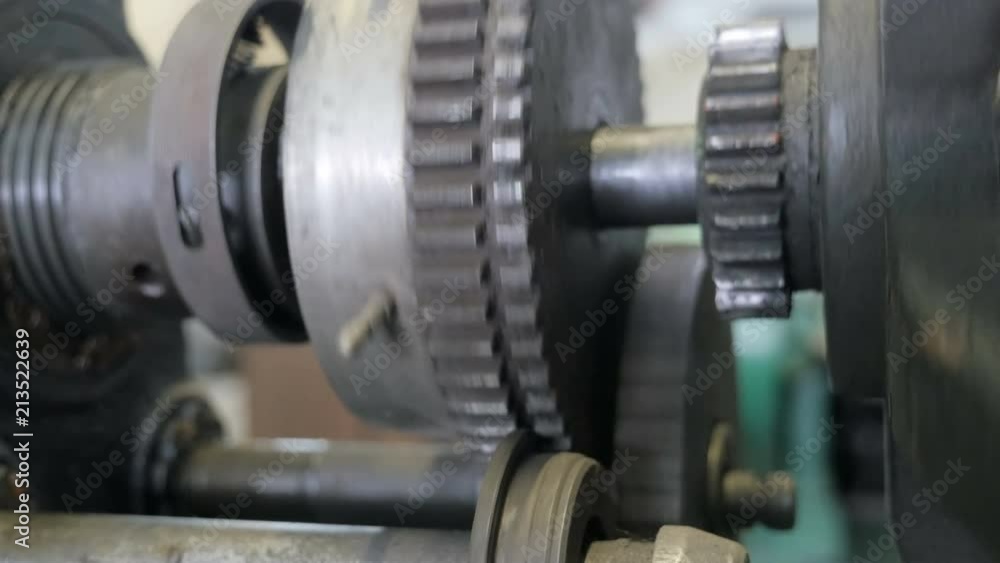 Movement of metal gears in a mechanical device. Closeup
Movement of metal gears in a mechanical device. Closeup
