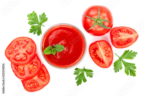 Tomato juice in glass and tomatoes with parsley leaves isolated on white background. Top view. Flat lay