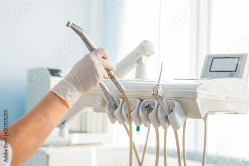 Dental health care concept background - Different stomatology instruments and tools in a dentists office. photo