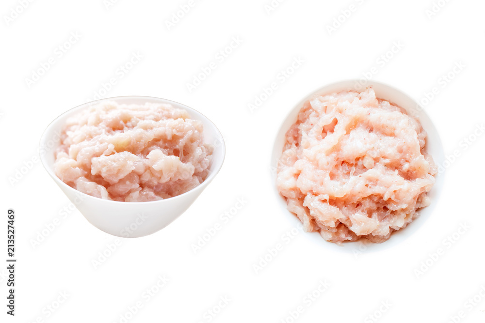 Raw chicken meat in round white plate isolated on white background. Fresh chicken minced ground-meat. Dietary fitness meat, low-calorie foods. Set of Raw ingredients for chicken dishes Raw chicken meat in round white plate isolated on white background. Fresh chicken minced ground-meat. Dietary fitness meat, low-calorie foods. Set of Raw ingredients for chicken dishes
