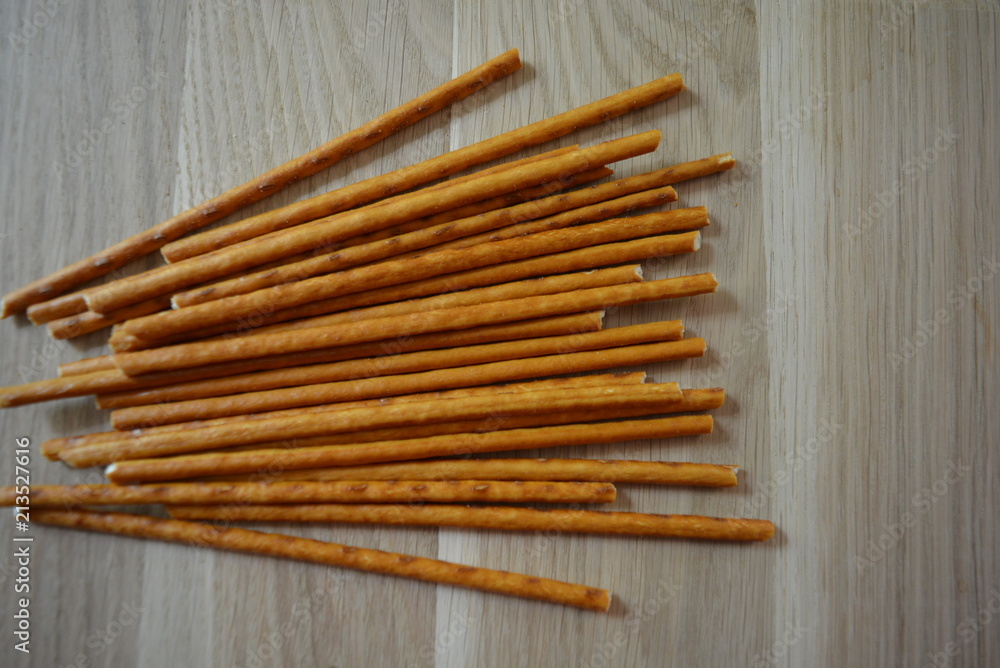 Sweet straws are located on a wooden light board