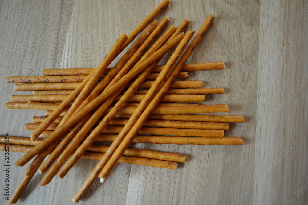 Sweet straws are located on a wooden light board Sweet straws are located on a wooden light board