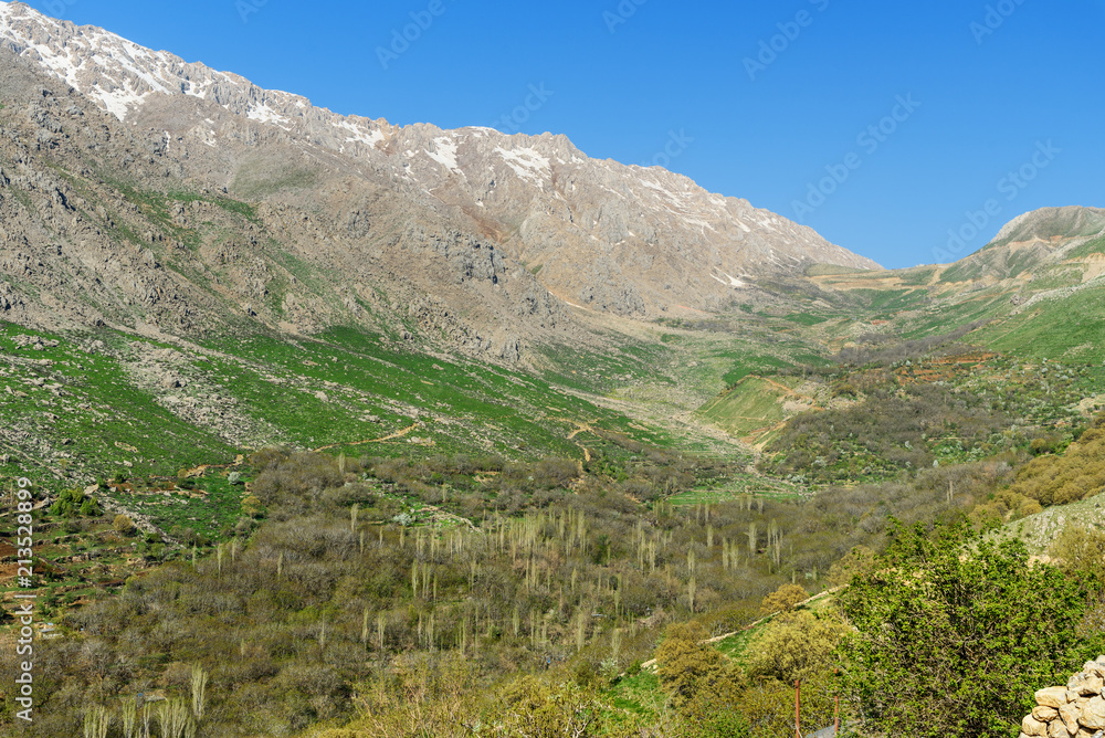 Naklejka premium Howraman Valley with typical Kurdish village in Zagros Mountain. Kurdistan Province, Iran.