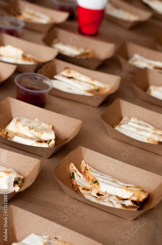 Snacks in paper eco-friendly boxes. Takeout food in a paper box. Fast food on the street