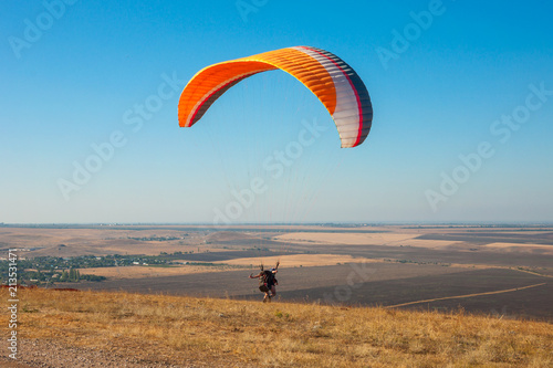paraglider flying in the sky on a Sunny day active in Koktebel