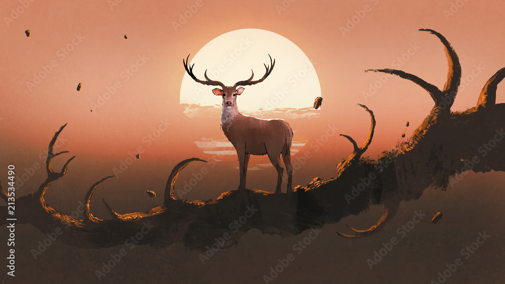 Fototapeta Jeleń stojący na gigantycznej gałęzi przypominającej rogi zwierzęcia na tle zachodzącego słońca