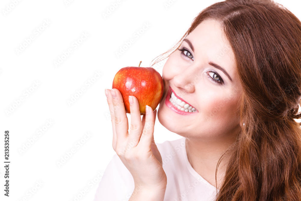 Woman holds apple fruit close to face, isolated Woman holds apple fruit close to face, isolated
