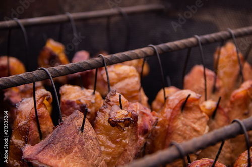 Yummy pork steaks and ribs smoked in old fashion smokehouse photo