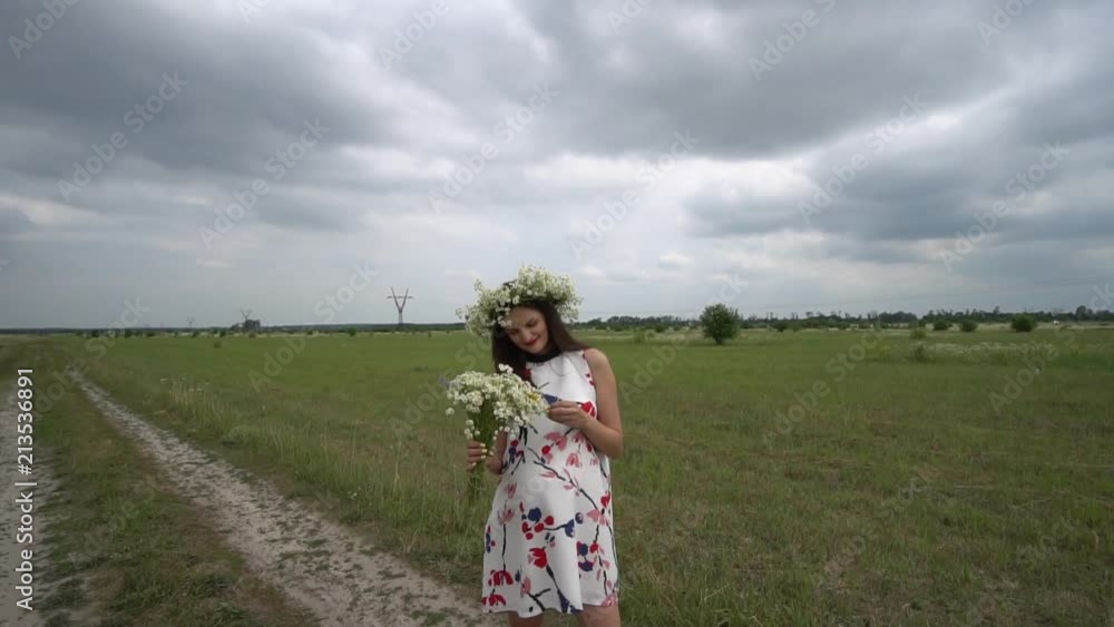 Pregnant woman with bouquet of camomile flowers. Pregnant woman with bouquet of camomile flowers.