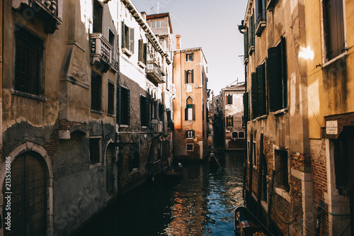 Scenic canal with ancient buildings in Venice, Italy
