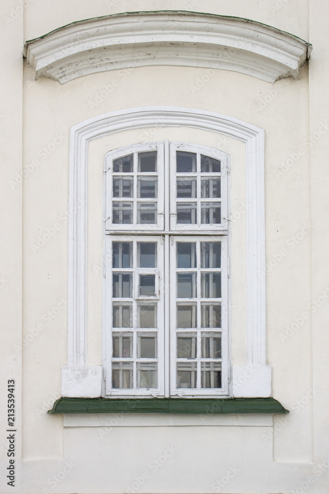 Photo of old cozy single window on old wall