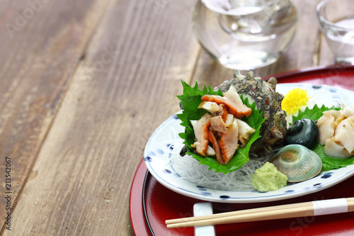 sazae ( horned turban shell ) sashimi, traditional japanese seafood dish photo