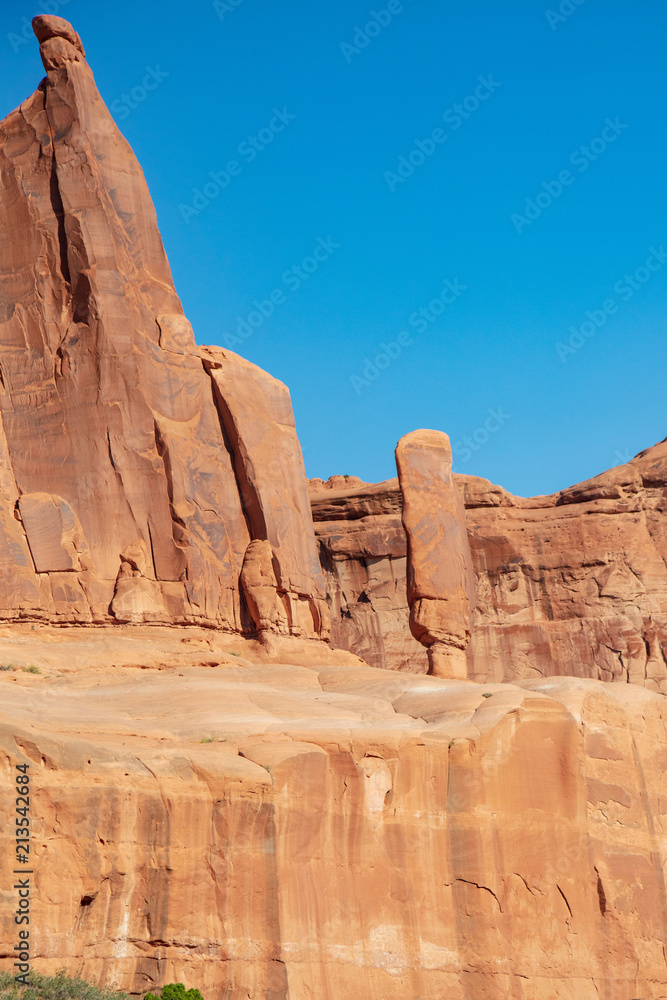 Study of a freestanding spire of red slickrock strata found along the Park Avenue Trail in Arches National Park Study of a freestanding spire of red slickrock strata found along the Park Avenue Trail in Arches National Park