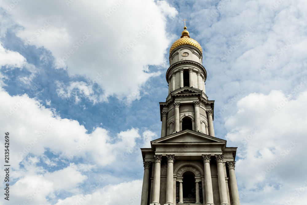 Blue sky with cloud. Yellow dome. Uspenskiy Sobor Located in the Kharkov Ukraine April 2018