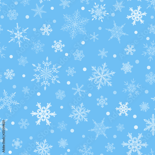 Christmas seamless pattern of snowflakes, white on light blue background.