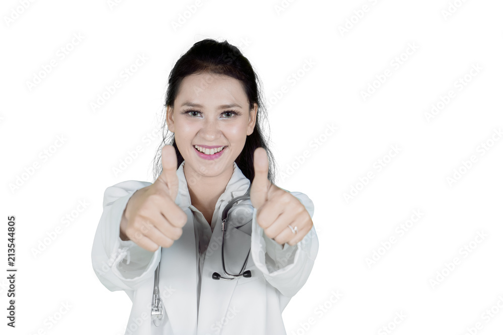 Caucasian female physician showing thumbs up Caucasian female physician showing thumbs up
