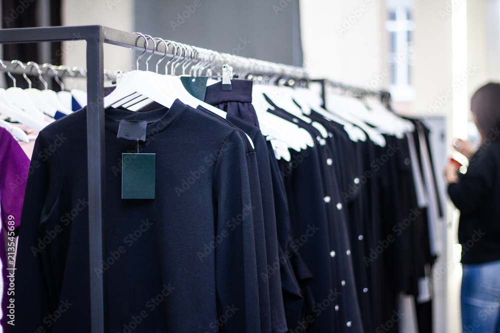 Fototapeta premium Clothing on hanger at the modern shop boutique