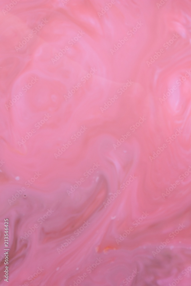 Multicolored holographic background, pink water droplets, multicolored pattern, food colors in milk, color texture on the water, blank for the designer