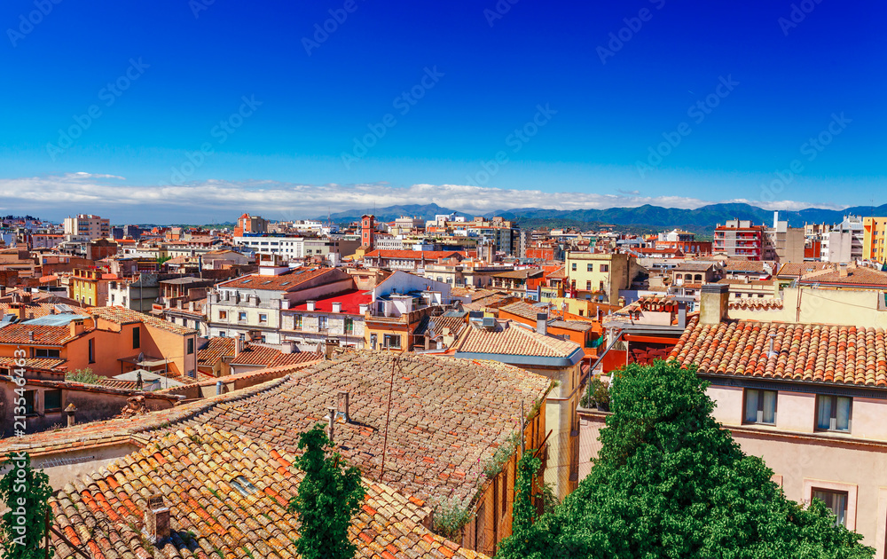 Top aerial view on Girona, Catalonia, Spain. Scenic and colorful ancient town. Famous tourist resort destination, perfect place for holiday and vacation.