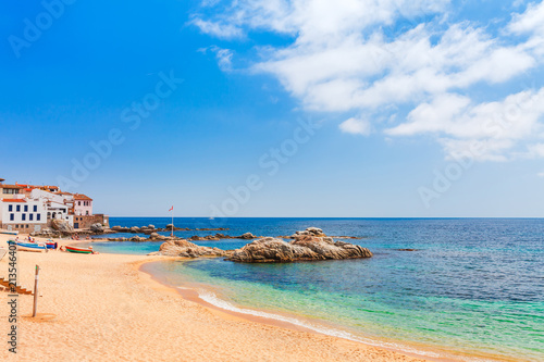 Sea landscape with Calella de Palafrugell, Catalonia, Spain near of Barcelona. Scenic fisherman village with nice sand beach and clear blue water in nice bay. Famous tourist destination in Costa Brava