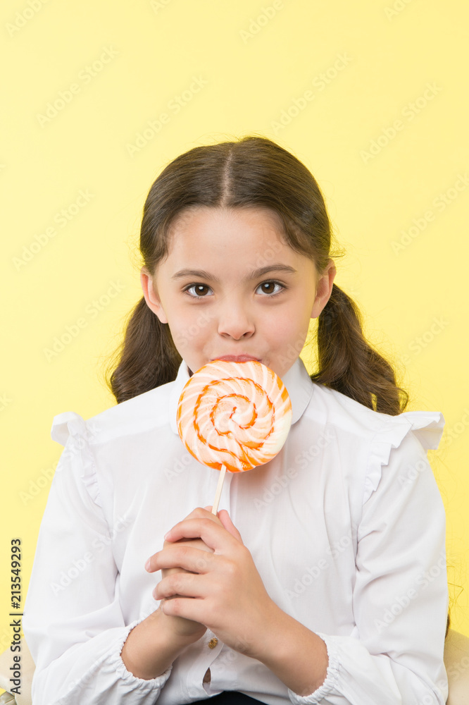 dieting. dieting and healthy food concept. dieting after dessert eating. small girl with lollipop doesn't like dieting. healthy life.