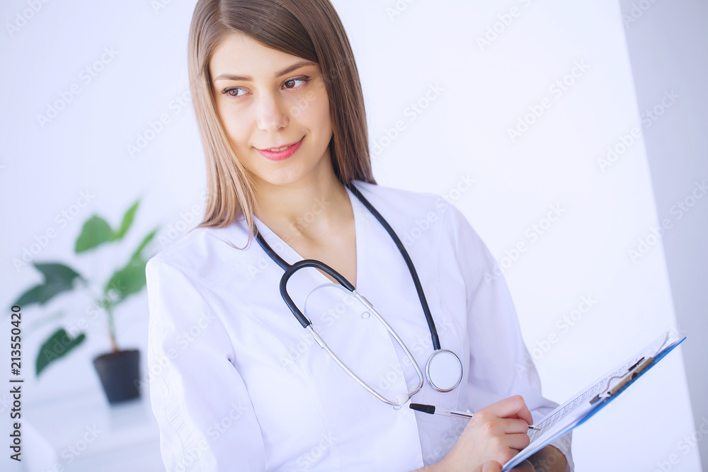 Healthcare Professional. Young female doctor on modern clinic office Healthcare Professional. Young female doctor on modern clinic office