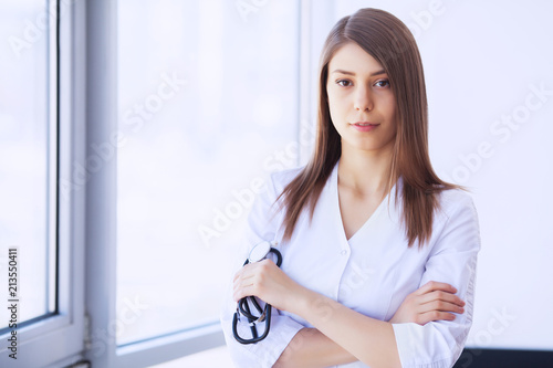 Clinic. Cheerful Doctor working at her office Free Download Clinic. Cheerful Doctor working at her office - GFXLoad
