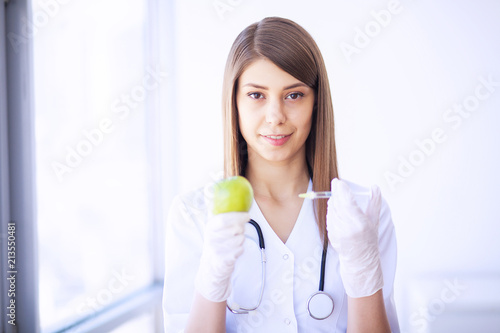 Clinic. Medical physician female doctor over clinic interior background.