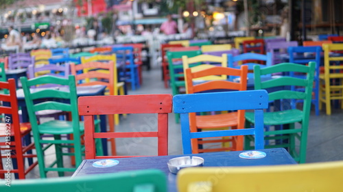 colored cafeteria chairs in holiday area © Cemaltaskiran