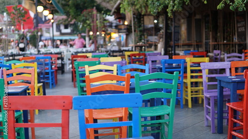 colored cafeteria chairs in holiday area © Cemaltaskiran