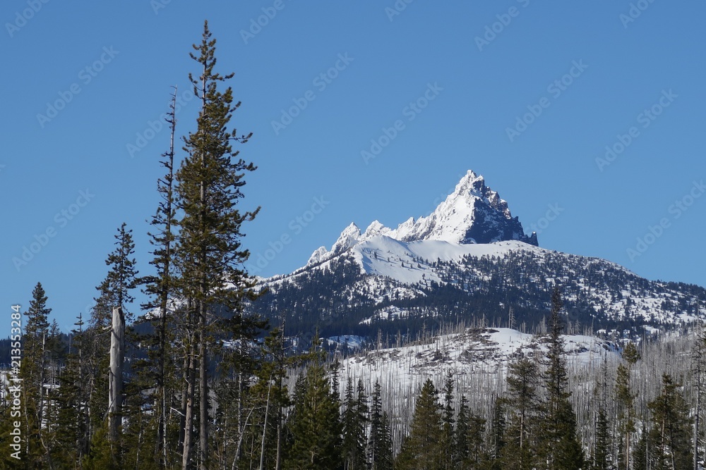 Stunning Mt. Washington with its jagged peak all covered in fresh snow on a sunny day 