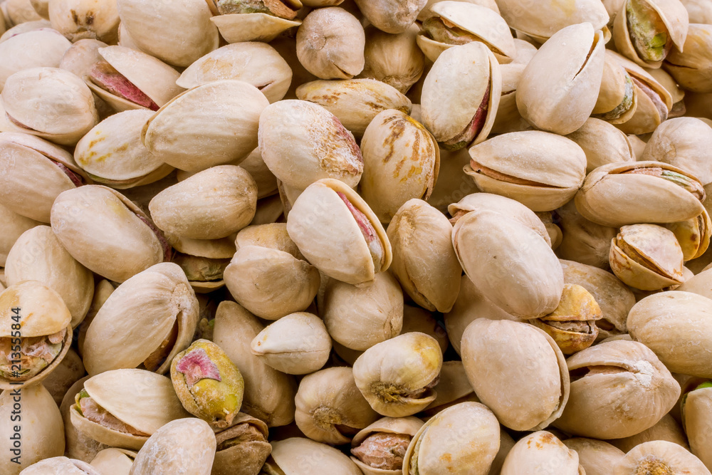 Pistachios on a wooden background