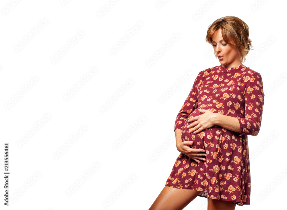 Happy pregnant woman touching her belly with hands. Happy pregnant woman touching her belly with hands.
