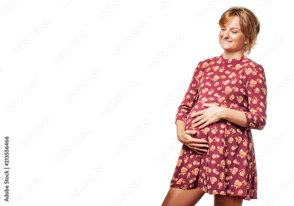 Happy pregnant woman touching her belly with hands. Happy pregnant woman touching her belly with hands.