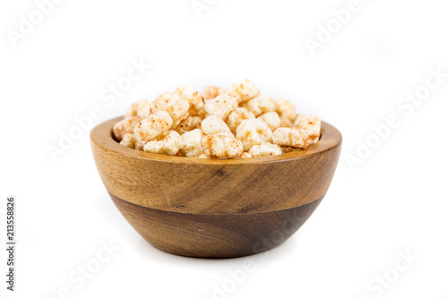 Piles of pale whole grain children's puffed cereal snack