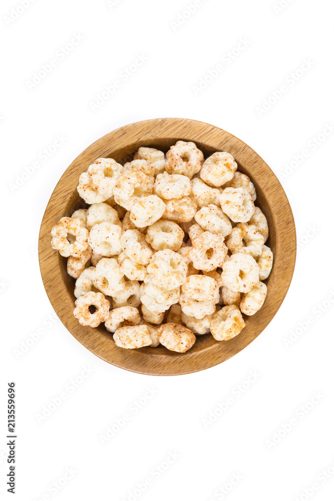 Piles of pale whole grain children's puffed cereal snack Piles of pale whole grain children's puffed cereal snack