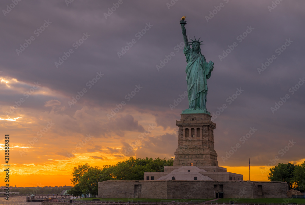 Sunset View of Statue of Liberty in New York Harbor