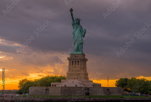 Sunset View of Statue of Liberty in New York Harbor