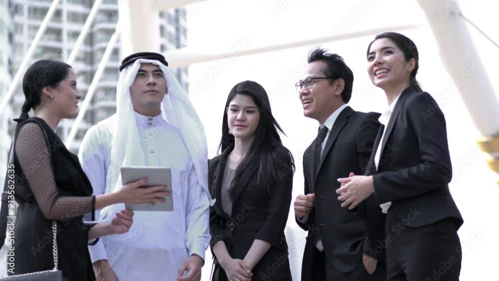 Business man United Arab Emirates and woman meeting together. concept of business middle east, agreement, partnership, teamwork and relationship. Business man United Arab Emirates and woman meeting together. concept of business middle east, agreement, partnership, teamwork and relationship.