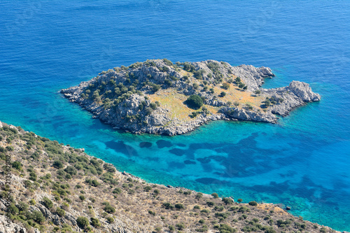Uninhabited Arap Adasi islet along the coastline between Sogut and Taslica near Marmaris resort town in Turkey.