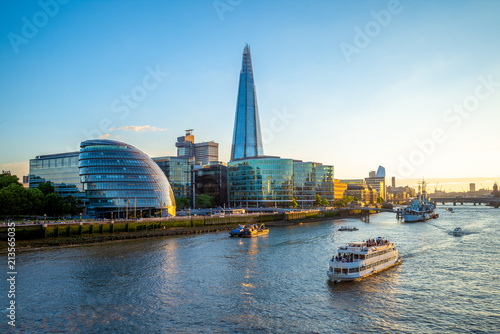 skyline of london by the thames river photo
