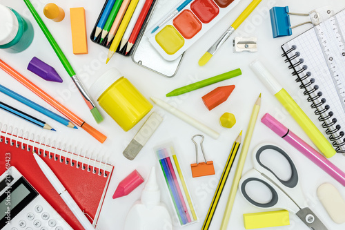 back to school concept. various writing tools and other school stationary on white background