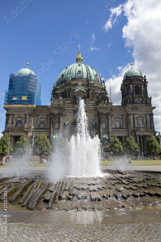 Berlin, Germany - July 01, 2018: Fountain in the center of the Lustgarten park in the background of the Berlin cathedral