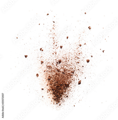 Coffee powder burst over white background